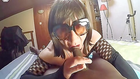 Ebony chick wearing stockings sucking a deepthroat cock