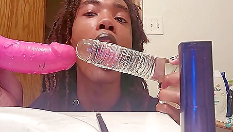 Ebony woman is getting her pussy fucked on a big dildo