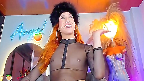 Busty redhead with a tattooed face and natural tits